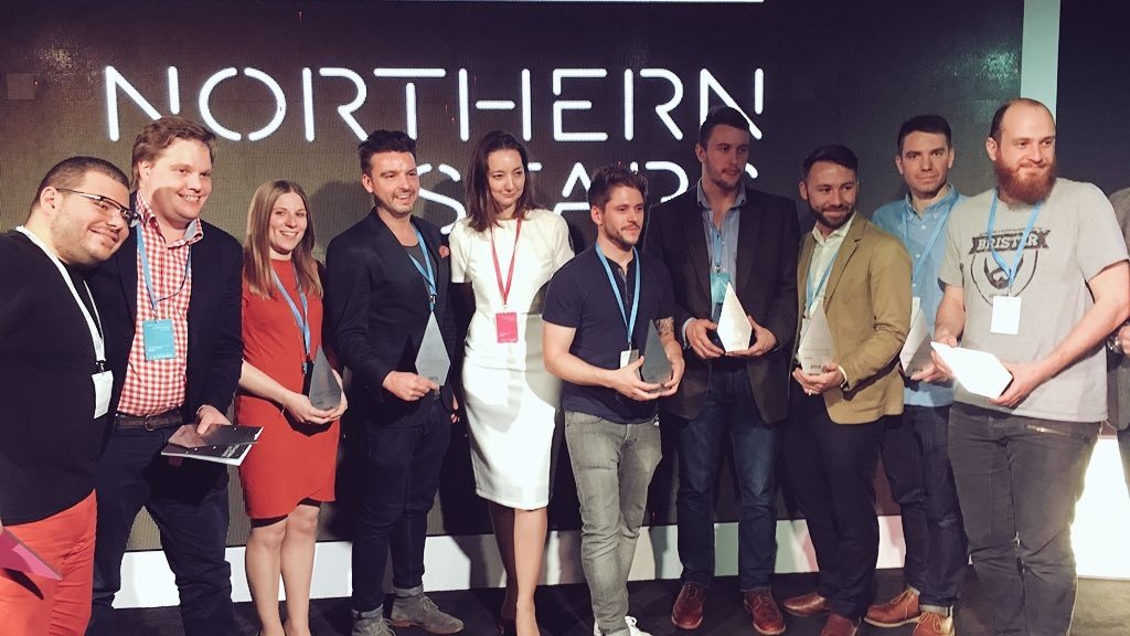 John awkwardly holding his award at Tech North's Northern Stars event.